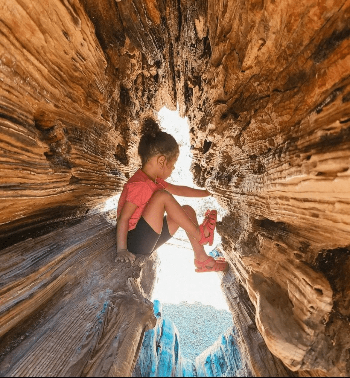 A young girl climbing in a fun spot for Bay Area Discovery Museum photos