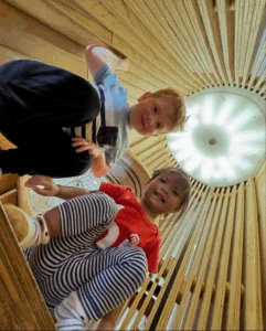A worm’s eye view of two children playing at the Bay Area Discovery Museum